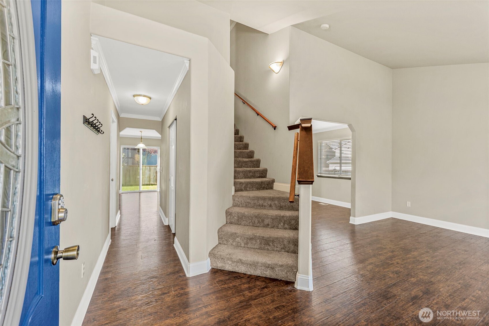 9115 Paradise View Street Yelm, WA 98597 - Photo 3 of 40 a view of a hallway with wooden floor and entryway