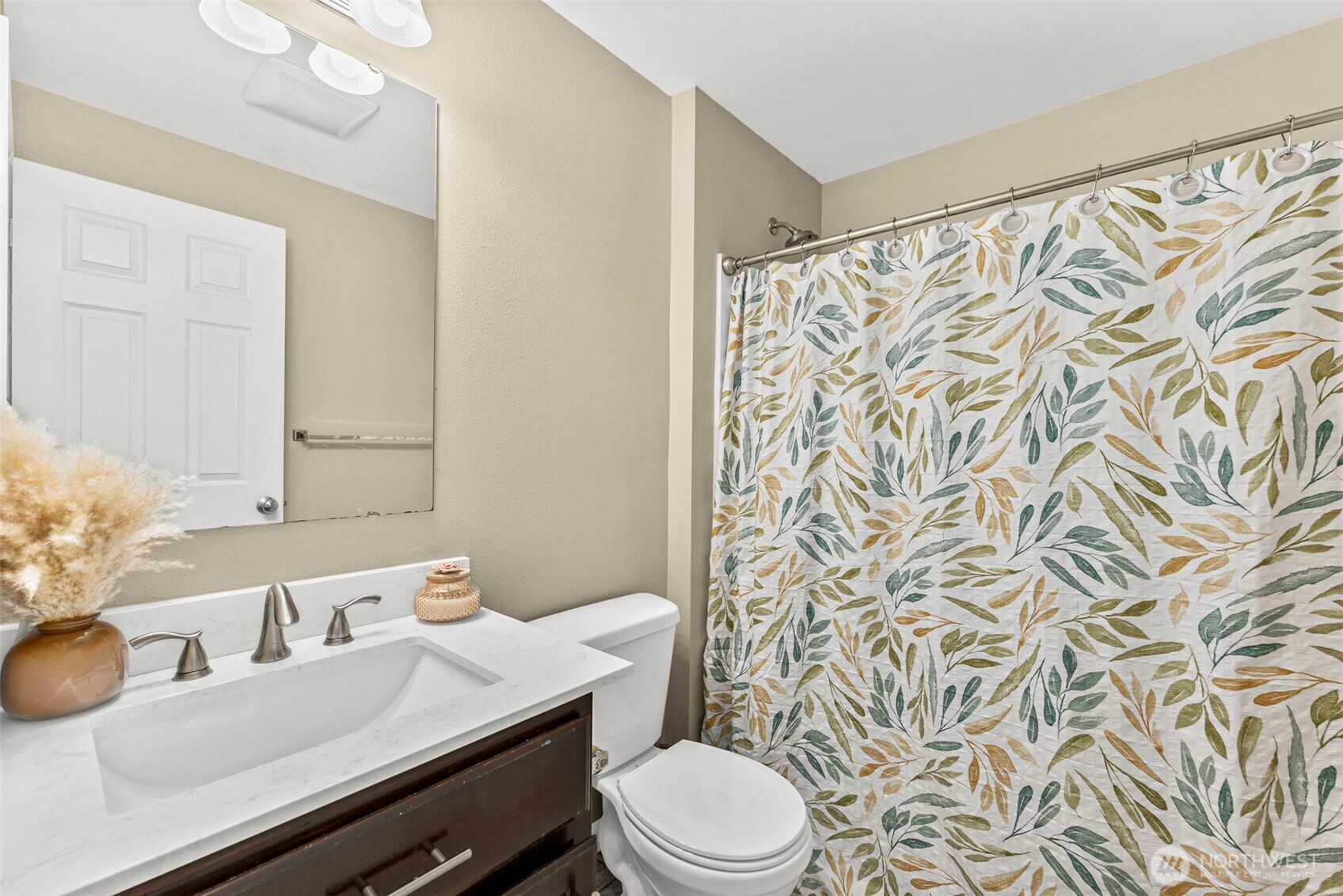 9115 Paradise View Street Yelm, WA 98597 - Photo 32 of 40 a bathroom with a sink toilet and shower