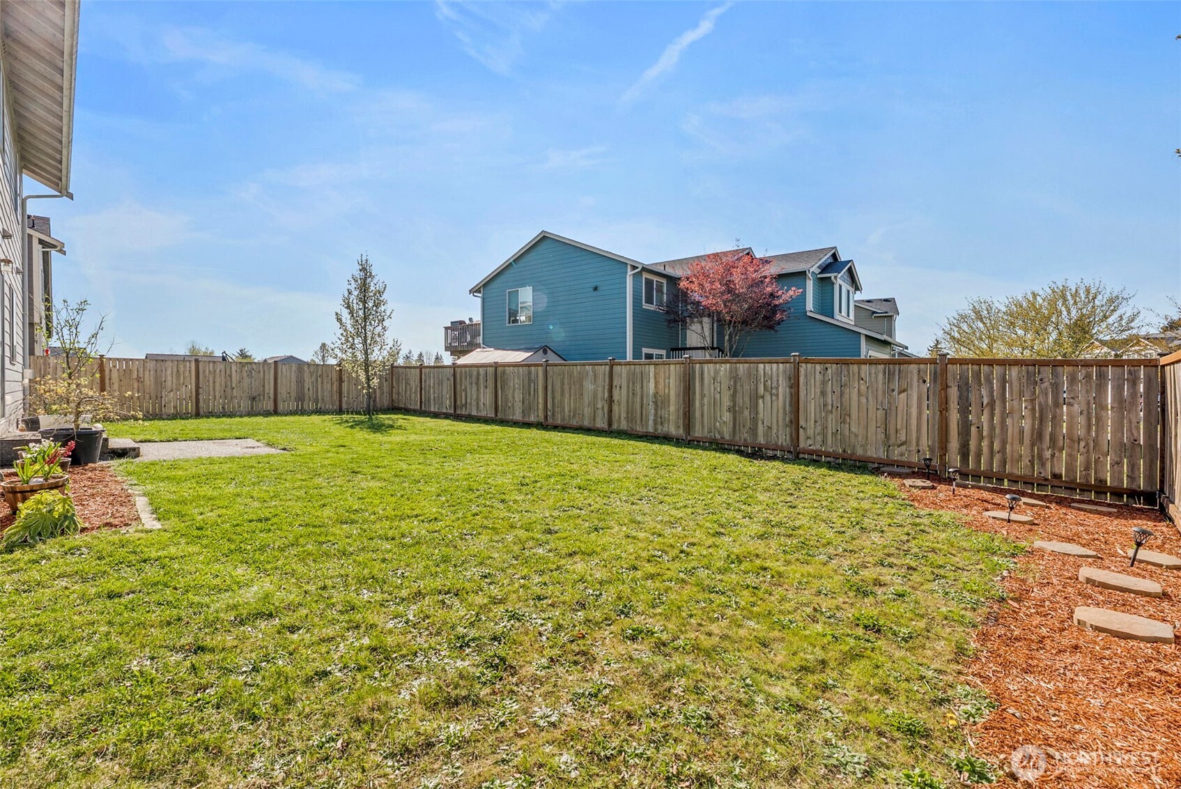 9115 Paradise View Street Yelm, WA 98597 - Photo 33 of 40 a view of a terrace with a garden
