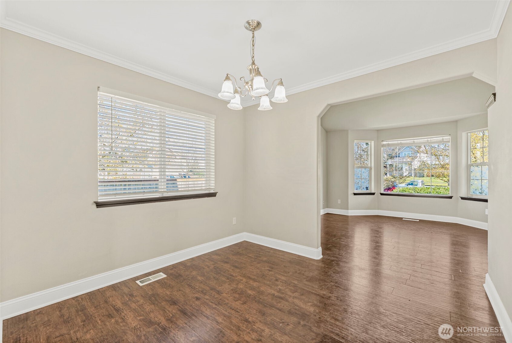 9115 Paradise View Street Yelm, WA 98597 - Photo 8 of 40 a view of livingroom with window ceiling fan and hardwood floor
