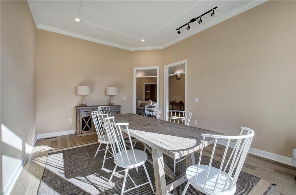 264 Boone Ford Road Southeast Calhoun, GA 30701 - Photo 11 of 66 a view of a dining room with furniture and wooden floor