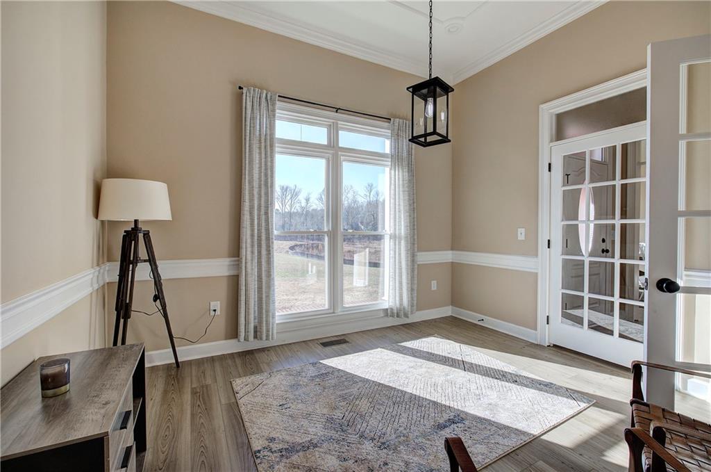 264 Boone Ford Road Southeast Calhoun, GA 30701 - Photo 13 of 66 a view of a room with gym equipment and a window
