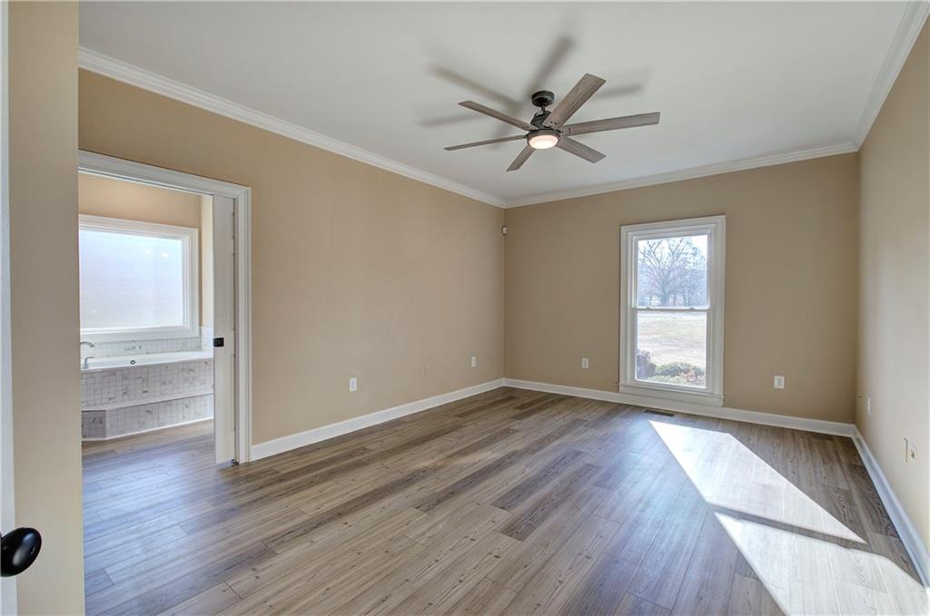 264 Boone Ford Road Southeast Calhoun, GA 30701 - Photo 23 of 66 wooden floor in an empty room with a window