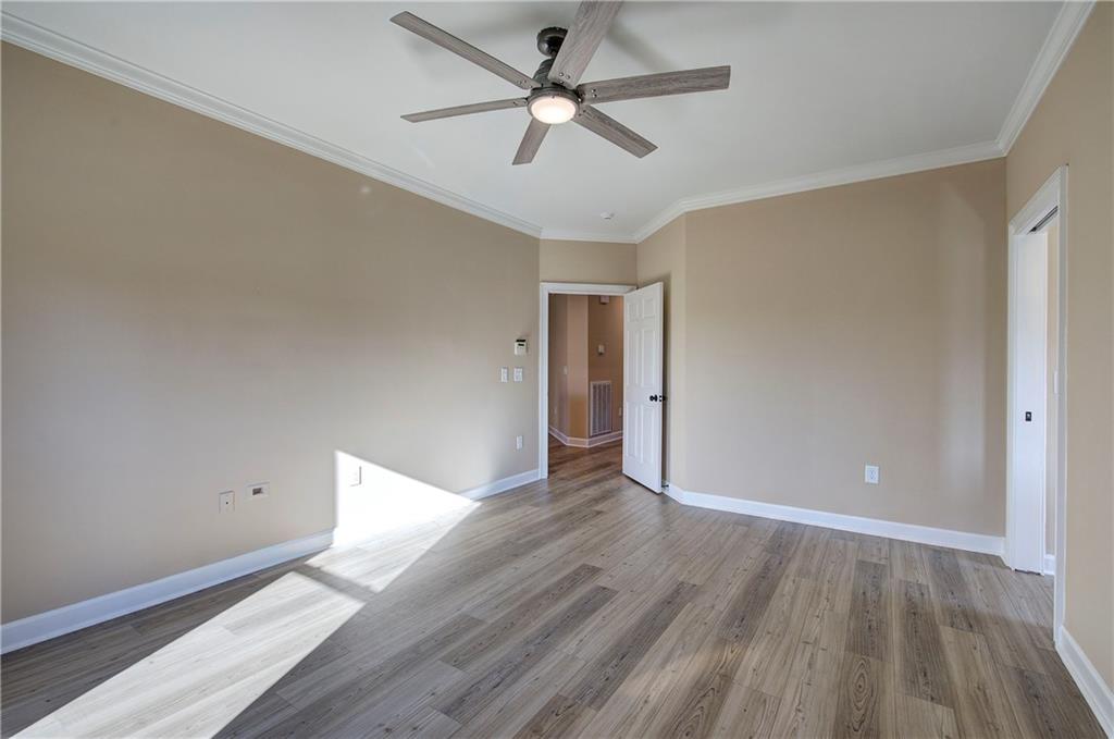 264 Boone Ford Road Southeast Calhoun, GA 30701 - Photo 24 of 66 wooden floor in an empty room with a window