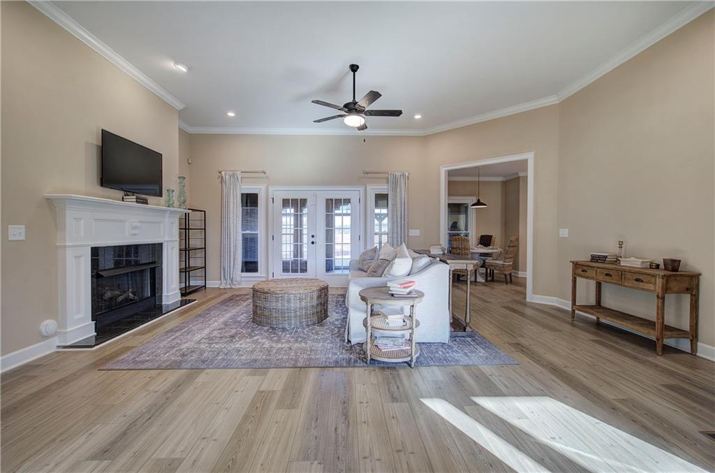 264 Boone Ford Road Southeast Calhoun, GA 30701 - Photo 3 of 66 a living room with furniture fireplace and flat screen tv