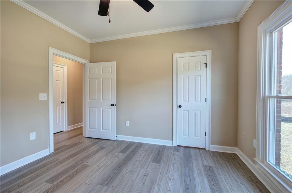 264 Boone Ford Road Southeast Calhoun, GA 30701 - Photo 39 of 66 wooden floor in an empty room with a window