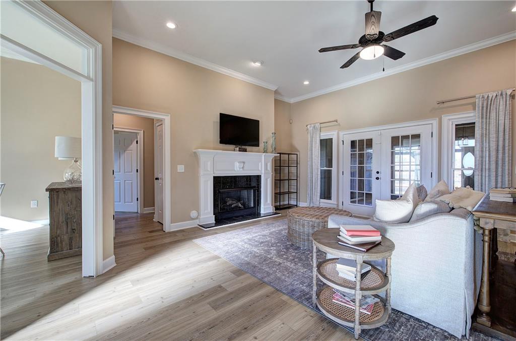 264 Boone Ford Road Southeast Calhoun, GA 30701 - Photo 4 of 66 a living room with furniture a flat screen tv and a fireplace