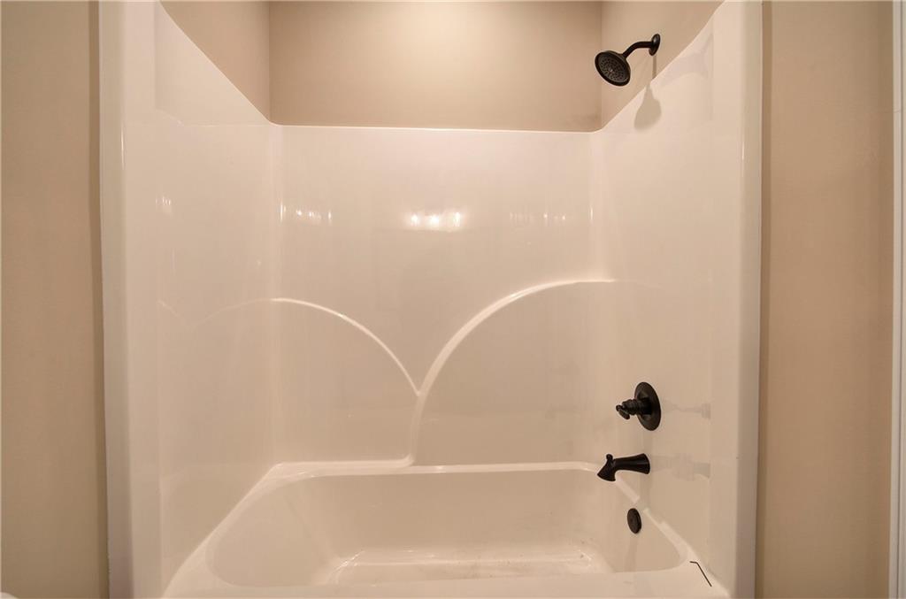 264 Boone Ford Road Southeast Calhoun, GA 30701 - Photo 45 of 66 a bathroom with a bathtub