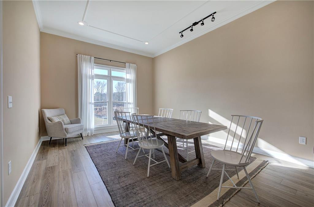 264 Boone Ford Road Southeast Calhoun, GA 30701 - Photo 10 of 66 a view of a dining room with furniture and wooden floor