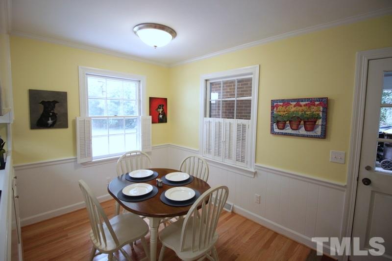 6921 Electra Drive Raleigh, NC 27607 - Photo 2 of 22 a view of a dining room with furniture and wooden floor