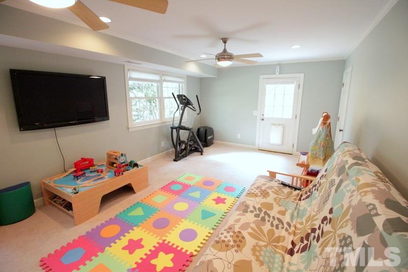 6921 Electra Drive Raleigh, NC 27607 - Photo 13 of 22 a bedroom with bed and flat screen tv