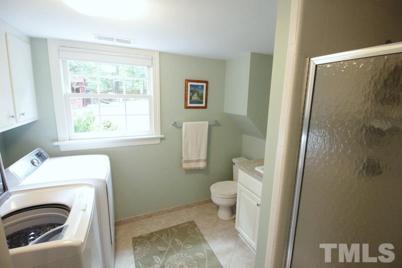 6921 Electra Drive Raleigh, NC 27607 - Photo 14 of 22 a bathroom with a sink and a toilet