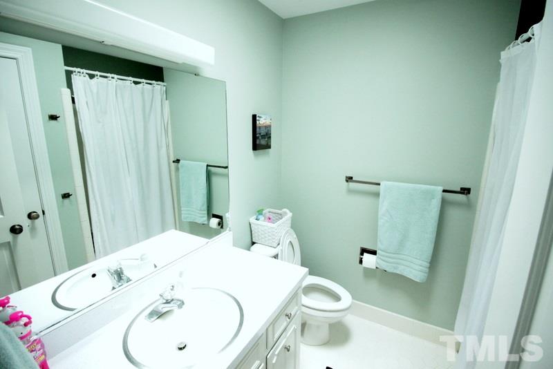 6921 Electra Drive Raleigh, NC 27607 - Photo 15 of 22 a bathroom with a sink and toilet