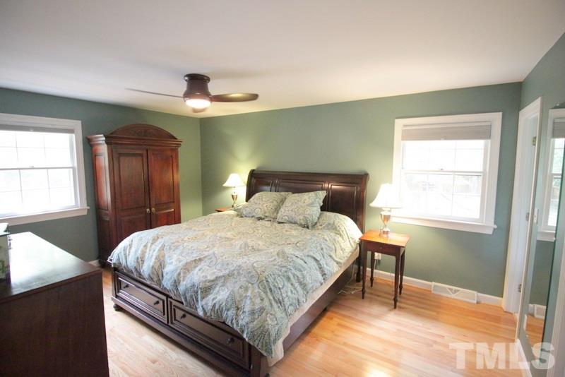 6921 Electra Drive Raleigh, NC 27607 - Photo 16 of 22 a bedroom with a bed and a window