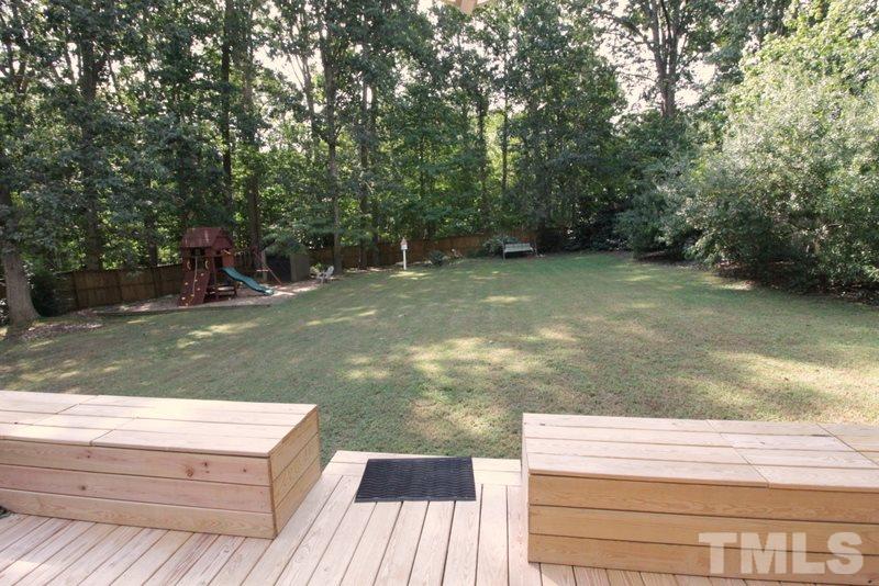 6921 Electra Drive Raleigh, NC 27607 - Photo 20 of 22 a view of a wooden deck and trees