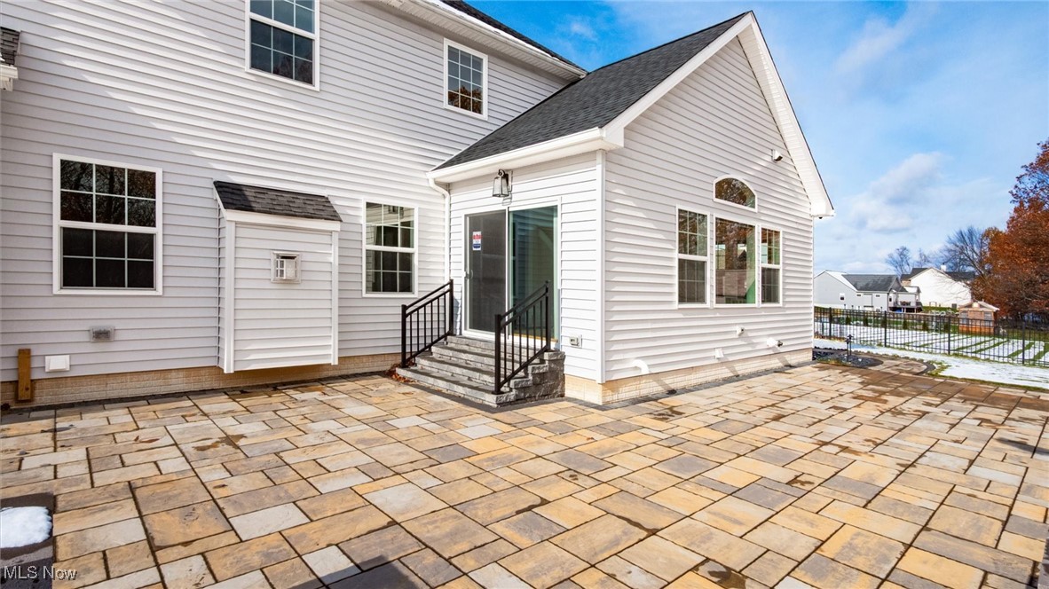 4641 Foote Road Medina, OH 44256 - Photo 42 of 46 Back of house featuring a patio, a shingled roof, and entry steps