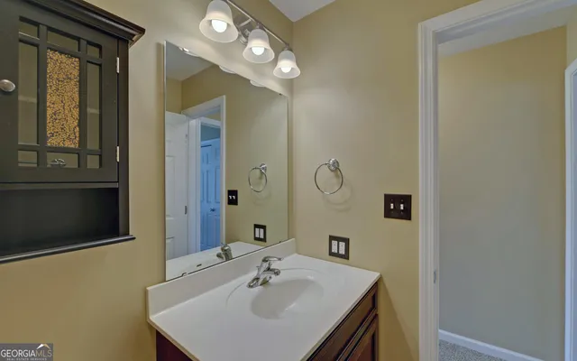 a bathroom with a sink and a mirror