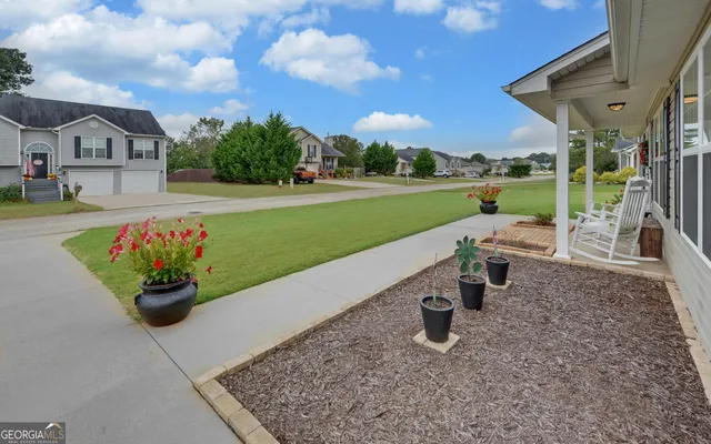 a view of a garden with patio