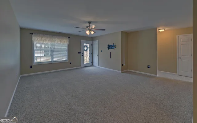 a view of empty room with windows