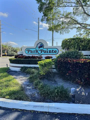 a view of a swimming pool with an outdoor space and seating area