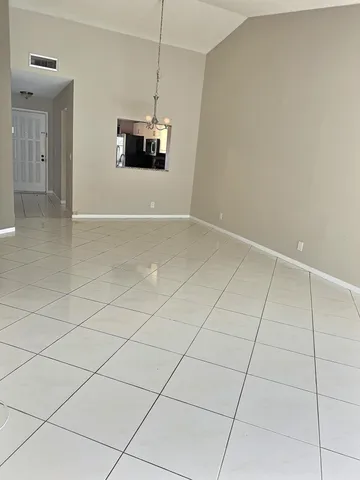 a view of wooden floor and brick wall