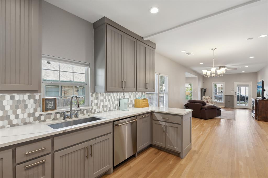 6100 Victor Street Dallas, TX 75214 - Photo 13 of 26 a kitchen with a sink cabinets and wooden floor