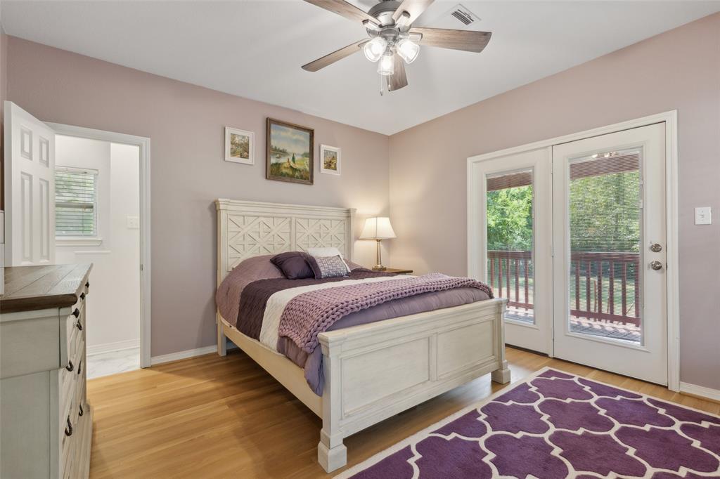 6100 Victor Street Dallas, TX 75214 - Photo 18 of 26 a bed room with a bed and a window