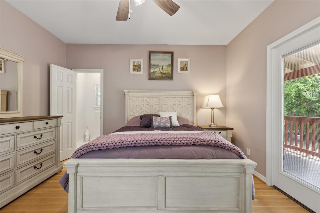 6100 Victor Street Dallas, TX 75214 - Photo 19 of 26 a spacious bedroom with a bed and a window