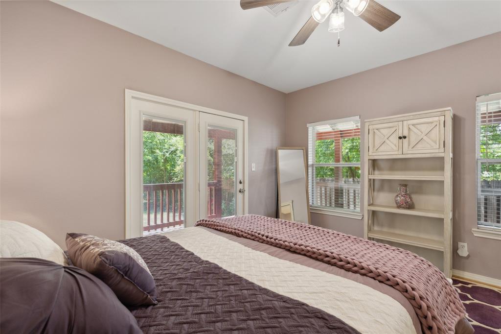 6100 Victor Street Dallas, TX 75214 - Photo 20 of 26 a bedroom with a large bed and a window