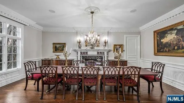 a kitchen with stainless steel appliances granite countertop a kitchen island a stove and a refrigerator