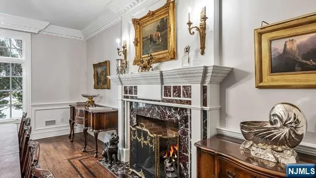 a living room with fireplace furniture and a window
