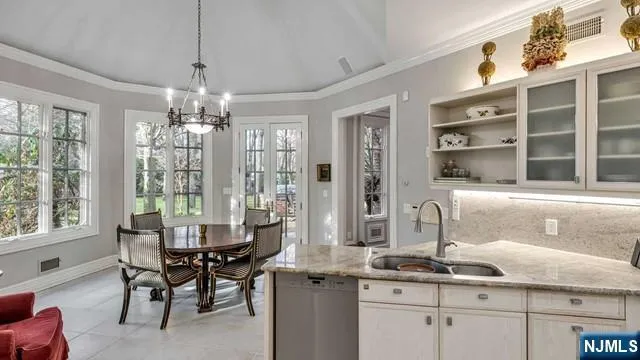 a dining table seating in a kitchen next to a window