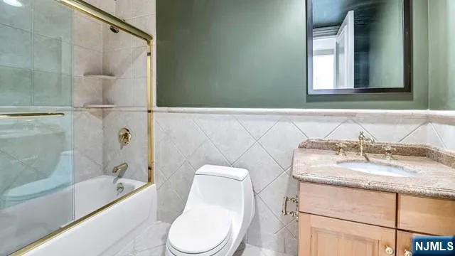 a view of a livingroom with wooden floor and windows