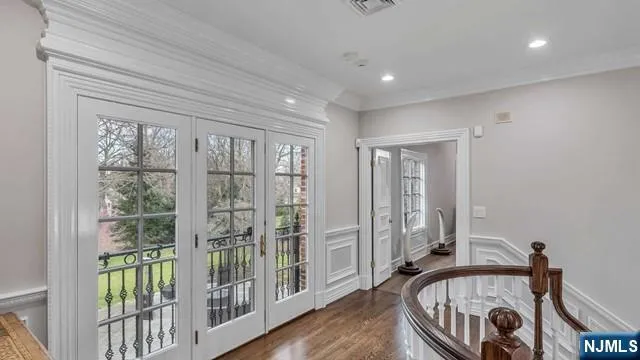 a bedroom with furniture window and a ceiling fan