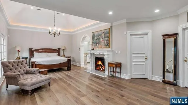 a spacious bathroom with a granite countertop double vanity sink and a mirror