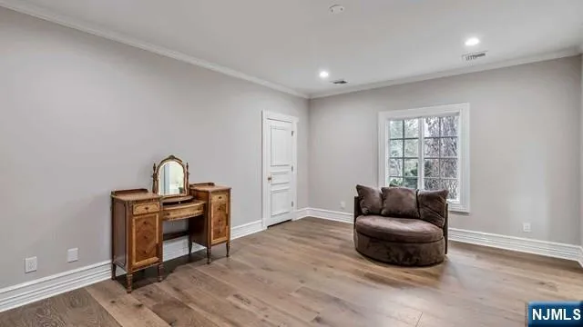 a bathroom with a granite countertop sink mirror and a bathtub