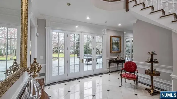 a living room with furniture a fireplace and a window