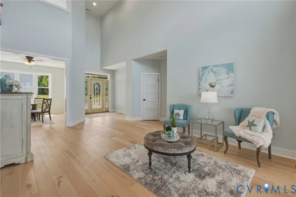 a view of an entryway with wooden floor and furniture