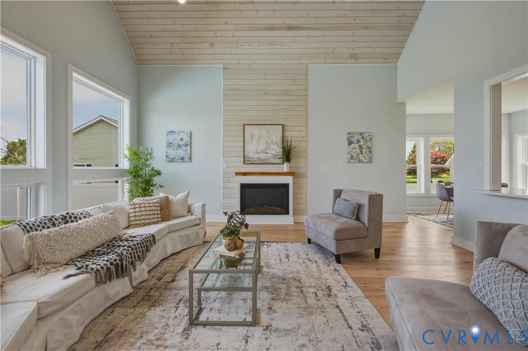 1355 Cowart Road Lottsburg, VA 22511 - Photo 20 of 65 a living room with furniture large window and a fireplace