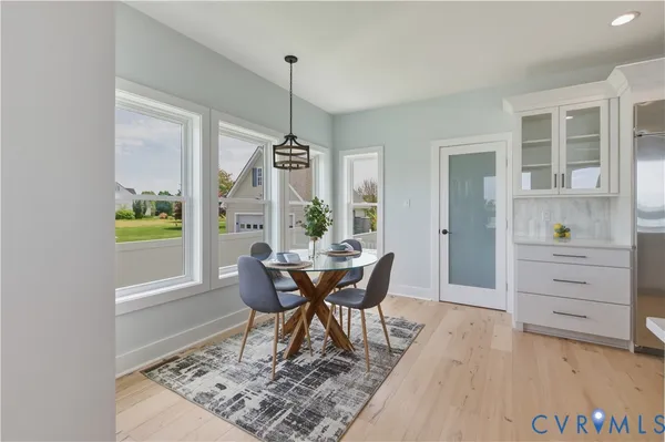 a large kitchen with stainless steel appliances and a sink