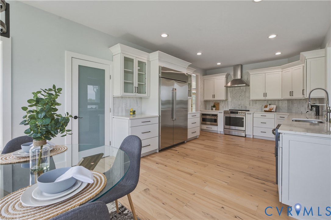 1355 Cowart Road Lottsburg, VA 22511 - Photo 27 of 65 a kitchen with stainless steel appliances granite countertop a refrigerator and a stove top oven