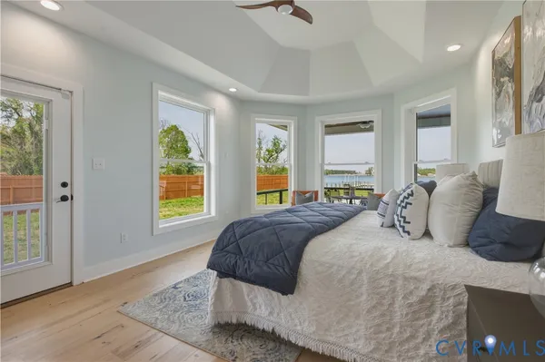 a bathroom with a tub sink shower and mirror