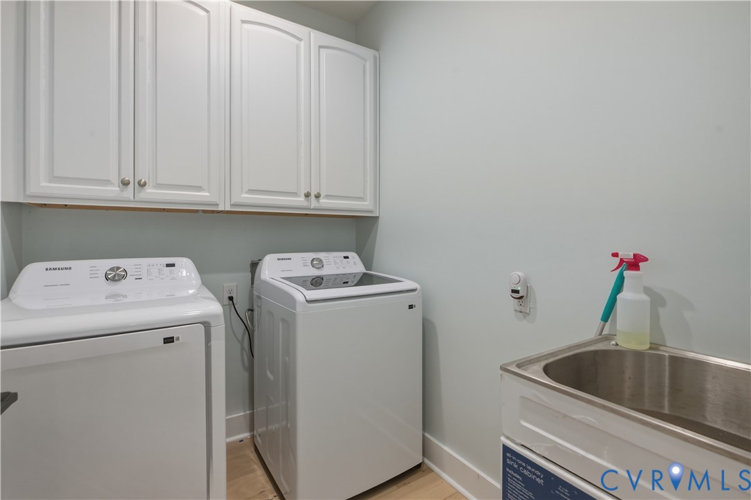 1355 Cowart Road Lottsburg, VA 22511 - Photo 37 of 65 a view of storage and utility room with a washer dryer