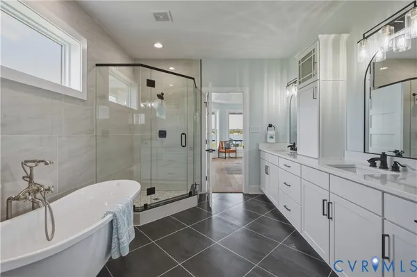 an empty room with chandelier fan