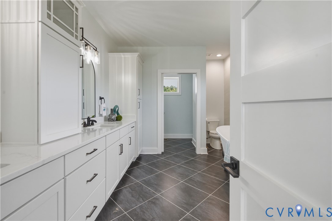 1355 Cowart Road Lottsburg, VA 22511 - Photo 42 of 65 a bathroom with a double vanity sink and a mirror