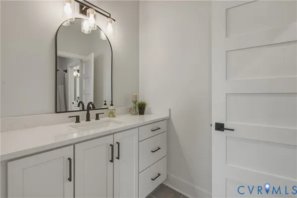 a view of a patio with table and chairs and wooden floor
