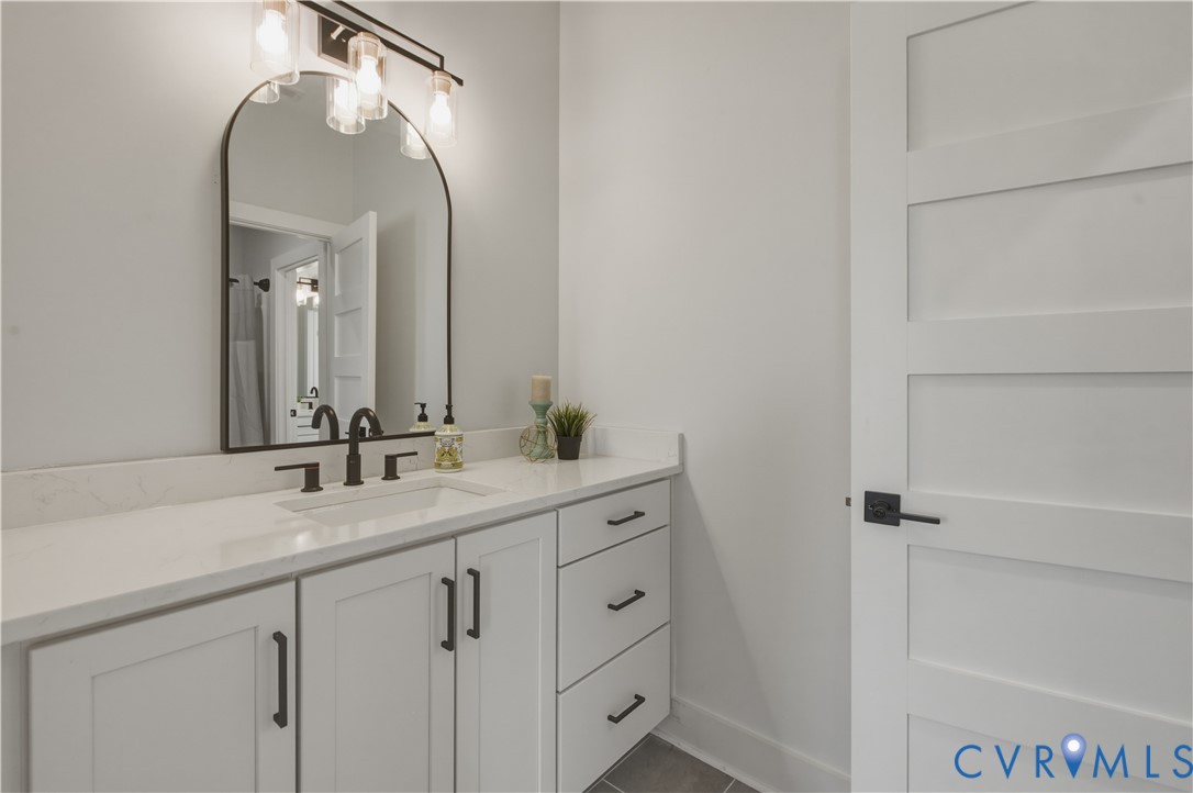 1355 Cowart Road Lottsburg, VA 22511 - Photo 49 of 65 a bathroom with a double vanity sink and a mirror
