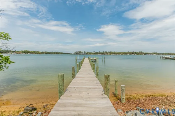 a view of a livingroom with furniture and hardwood floor
