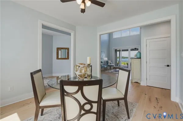a living room with furniture and a table with wooden floor