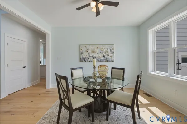 a view of entryway livingroom and hall with wooden floor